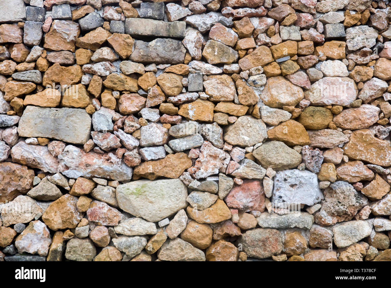 Closeup of the old stone wall texture backdrop Stock Photo - Alamy