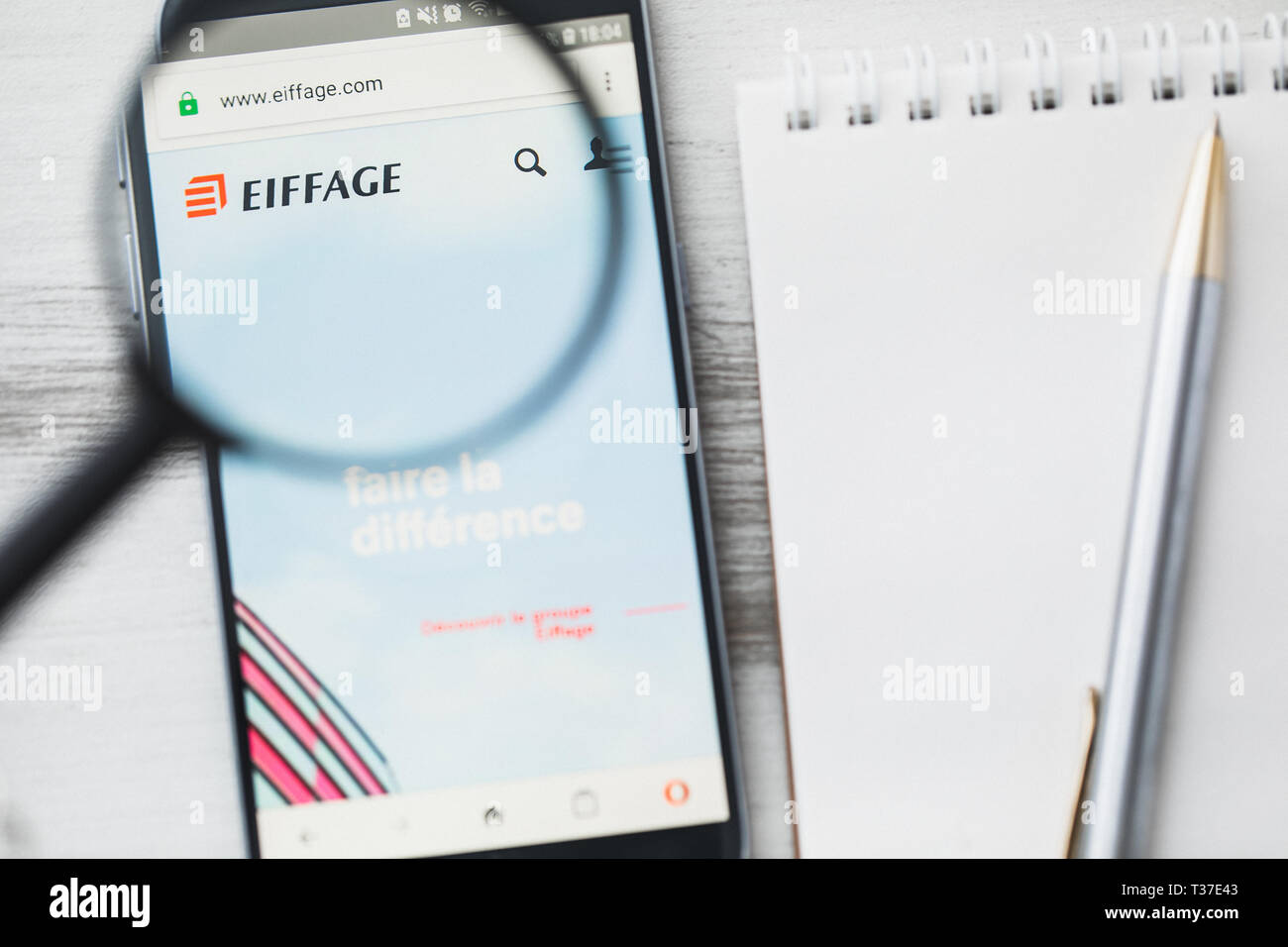 Los Angeles, California, USA - 3 April 2019: Eiffage S.A. official website homepage under magnifying glass. Concept Eiffage Civil engineering, constru Stock Photo
