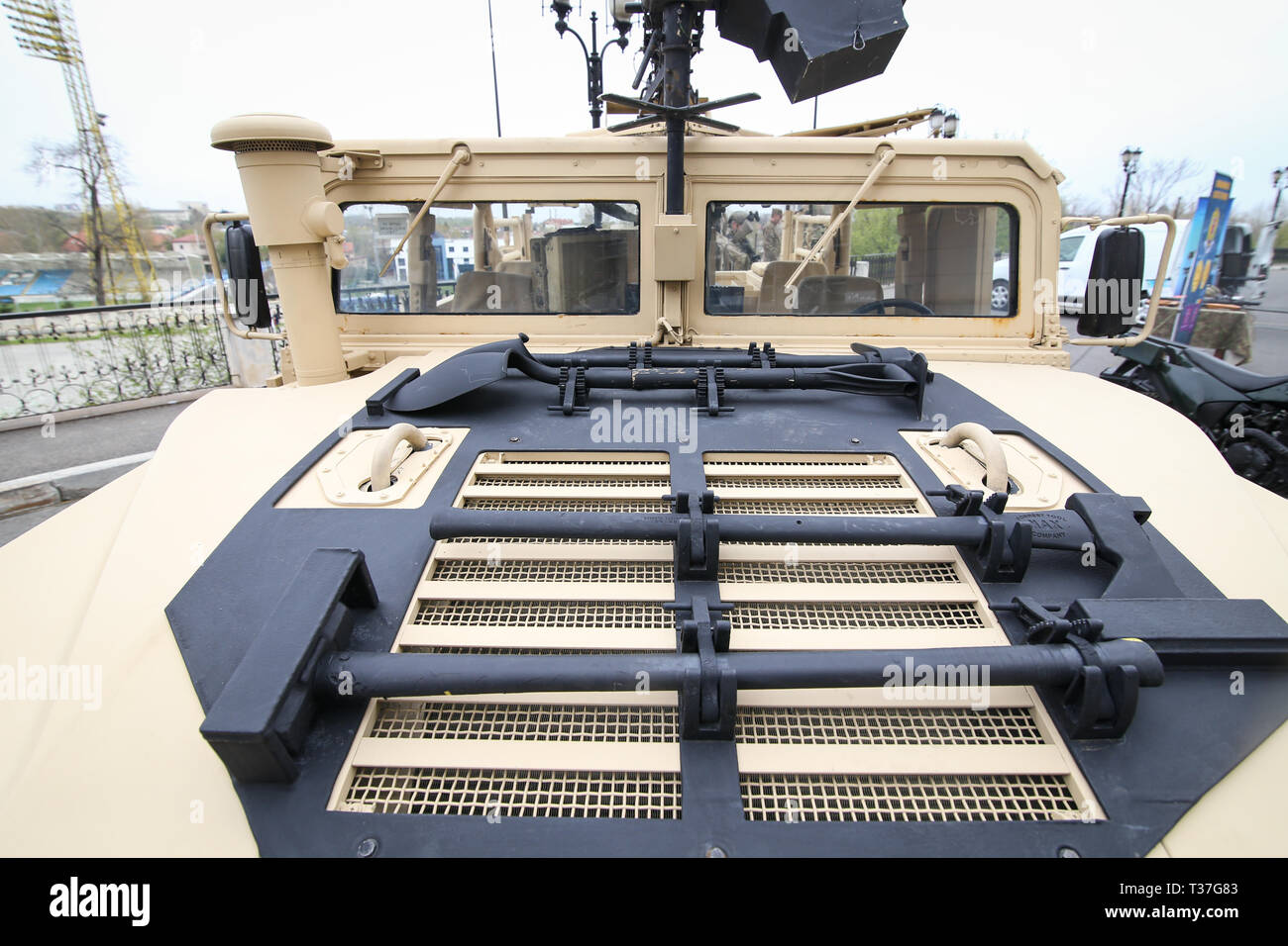 Bucharest, Romania - April 7, 2019: Tools mounted on the hood of a Humvee military vehicle - hammer, axe, shovel and pickaxe Stock Photo