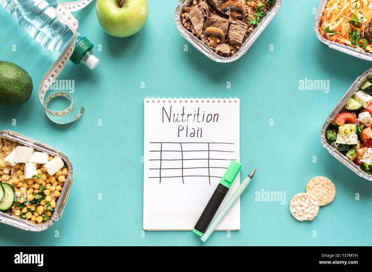 Nutrition meal plan mockup with healthy food delivery. Fitness nutrition for diet. Daily meals on blue, top view, copy space. Stock Photo