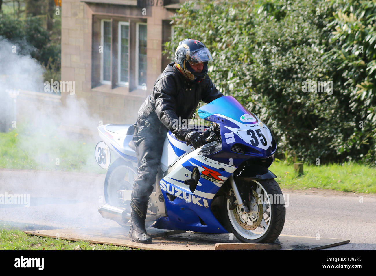 Bike wheels burning rubber, motorcycle, drift, smoke, race spin, burning  tire, rolling burnout, peeling out, at Chorley, Lancashire, UK. 7th April,  2019. Hoghton Tower 43rd Motorcycle Sprint. Rider 35 Ashley Hodgson from