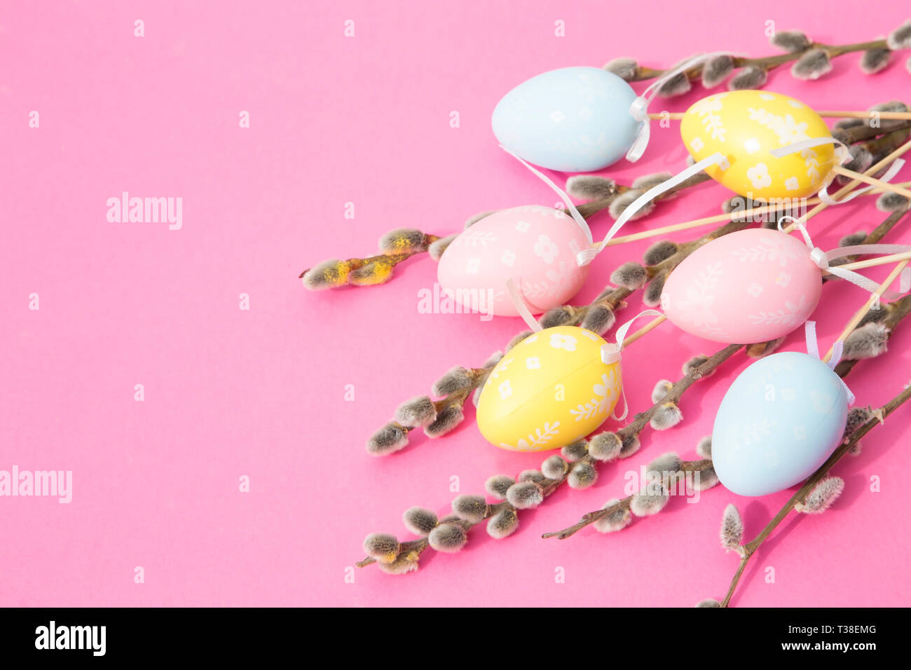 Easter eggs and willow branches on pink background Stock Photo - Alamy
