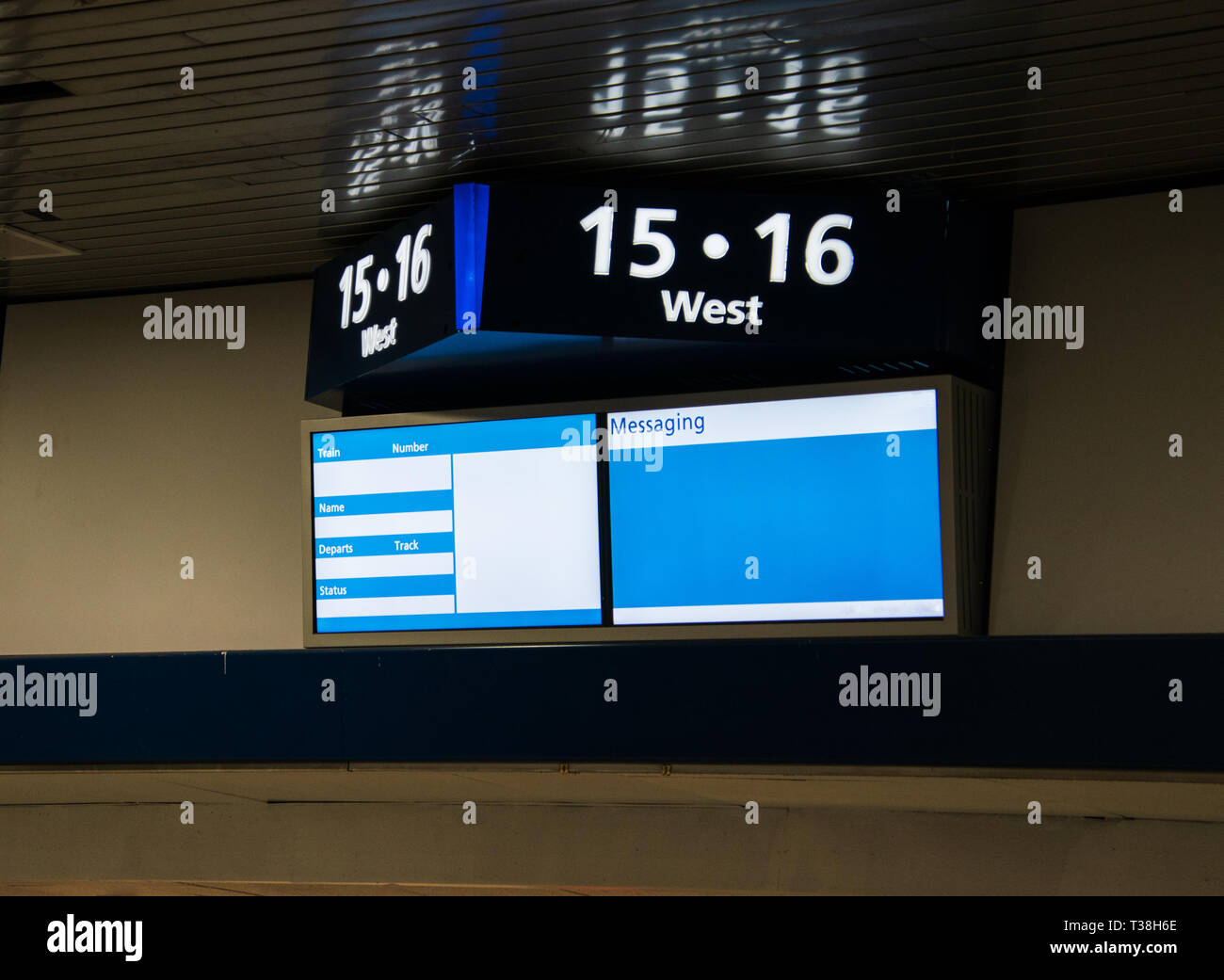 Sign On A Wall Near The Ceiling Top Part Shows Track Numbers And