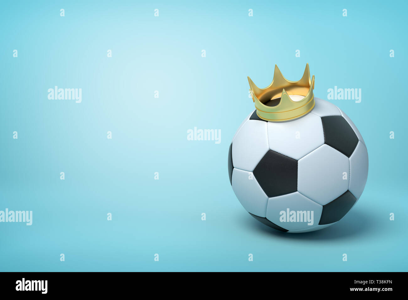 3d rendering of a football wearing a golden crown on light blue background. Stock Photo