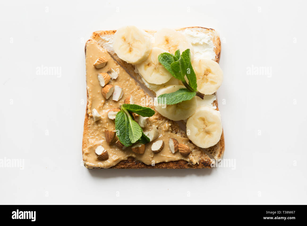 Different types of sandwiches for healthy children's breakfast without sugar, with nut paste, bananas. View from above. Stock Photo