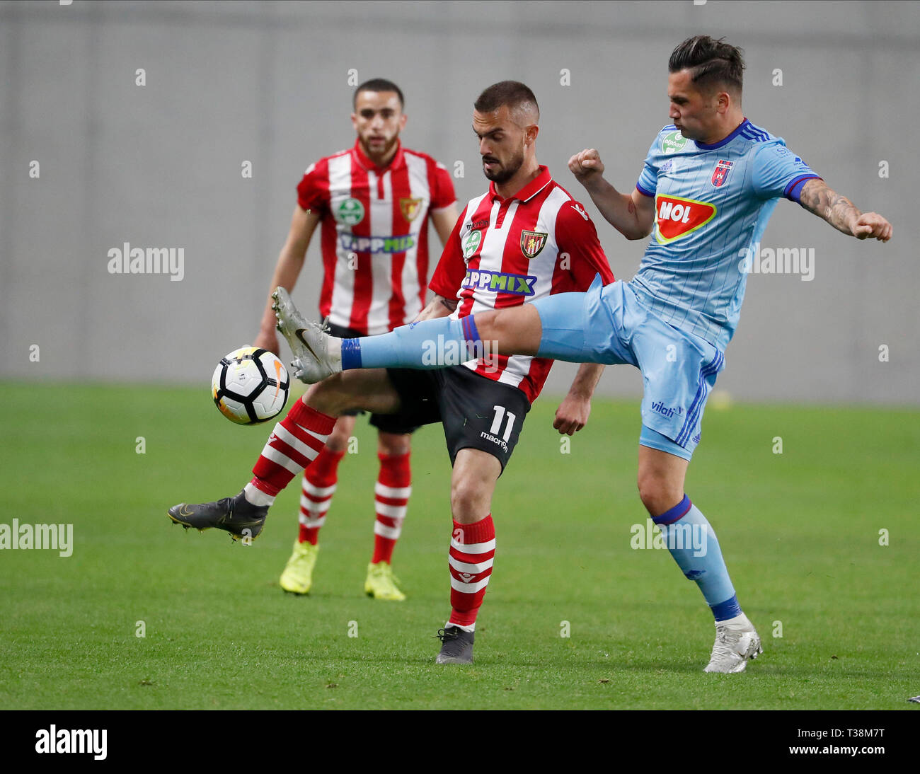 BUDAPEST, HUNGARY - APRIL 6: (r-l) Anel Hadzic of MOL Vidi FC challenges  Filip Holender of Budapest Honved in front of Mohamed Mezghrani of Budapest  Honved during the Hungarian OTP Bank Liga