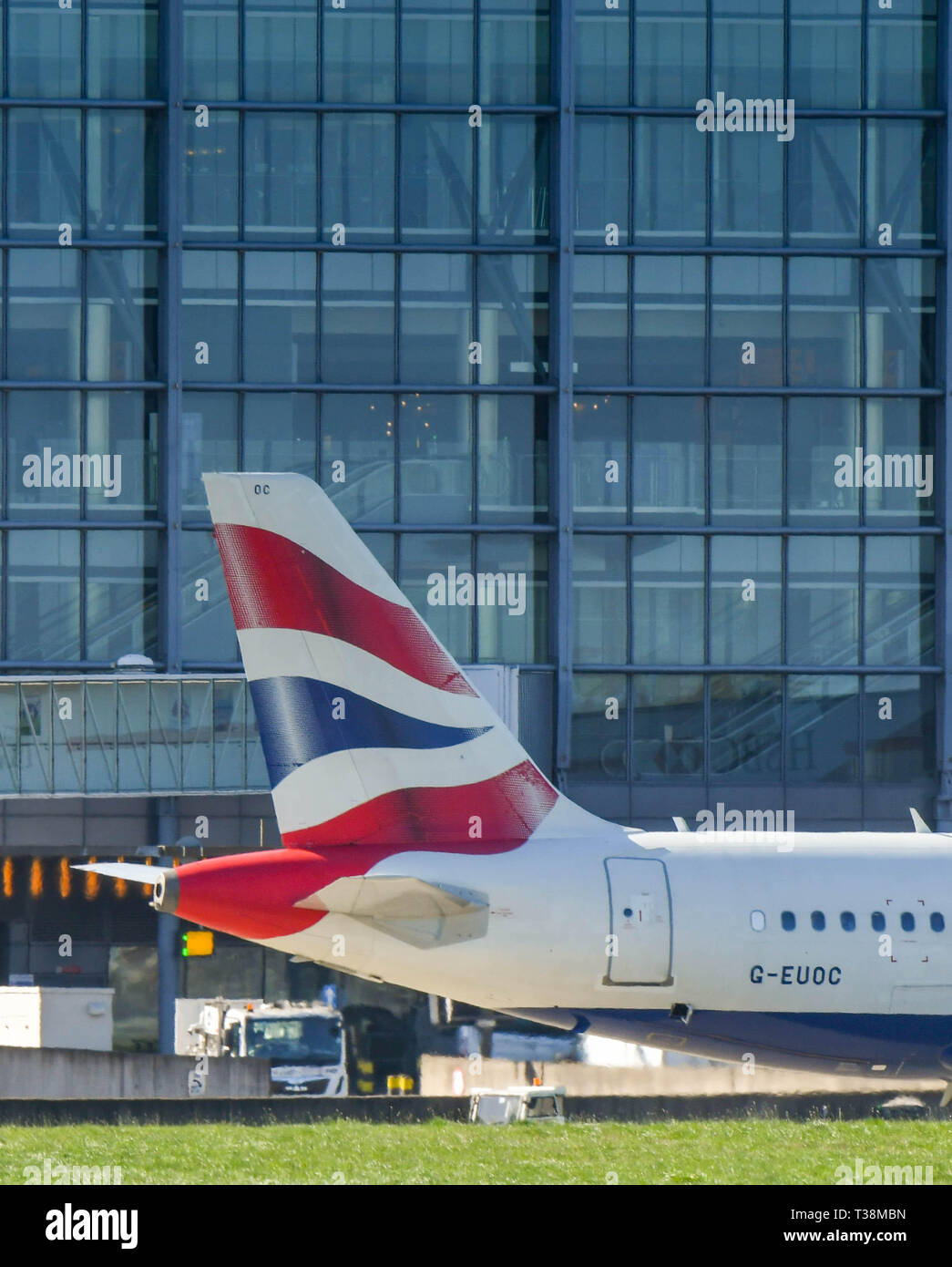 LONDON, ENGLAND - MARCH 2019: British Airways Airbus A319 airliner taxiing past the Terminal 5 building at London Heathrow Airport. Stock Photo