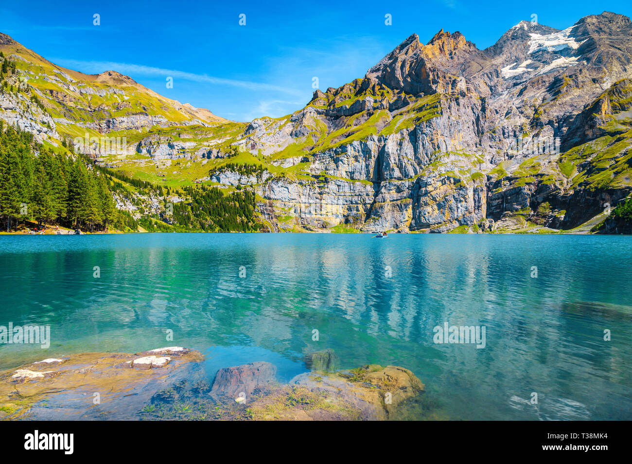 Fantastic travel and tourism location, amazing alpine lake and snowy mountains with glaciers, Oeschinensee lake, Bernese Oberland, Switzerland, Europe Stock Photo