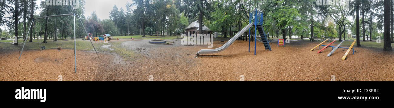 Horizontal panorama of a playground on dirt. Stock Photo