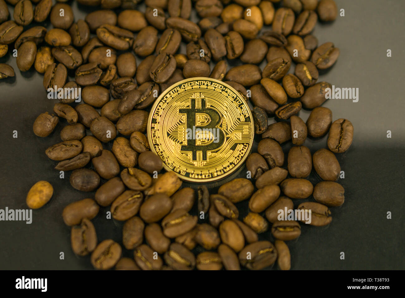 Bitcoin cryptocurrency coin as payment currency surrounded with coffee beans  Stock Photo - Alamy
