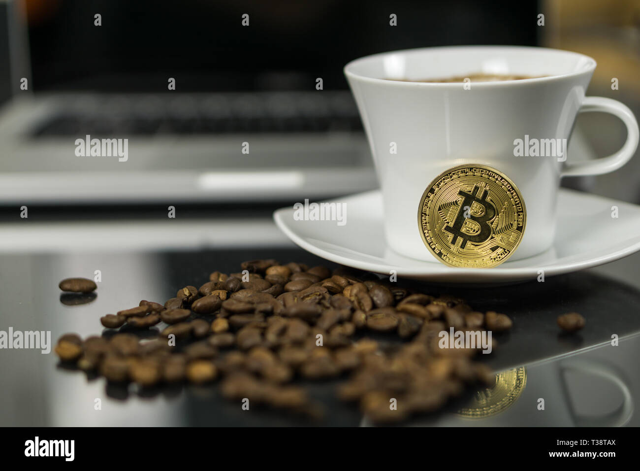 Bitcoin cryptocurrency coin with coffee cup and coffee beans Stock Photo -  Alamy
