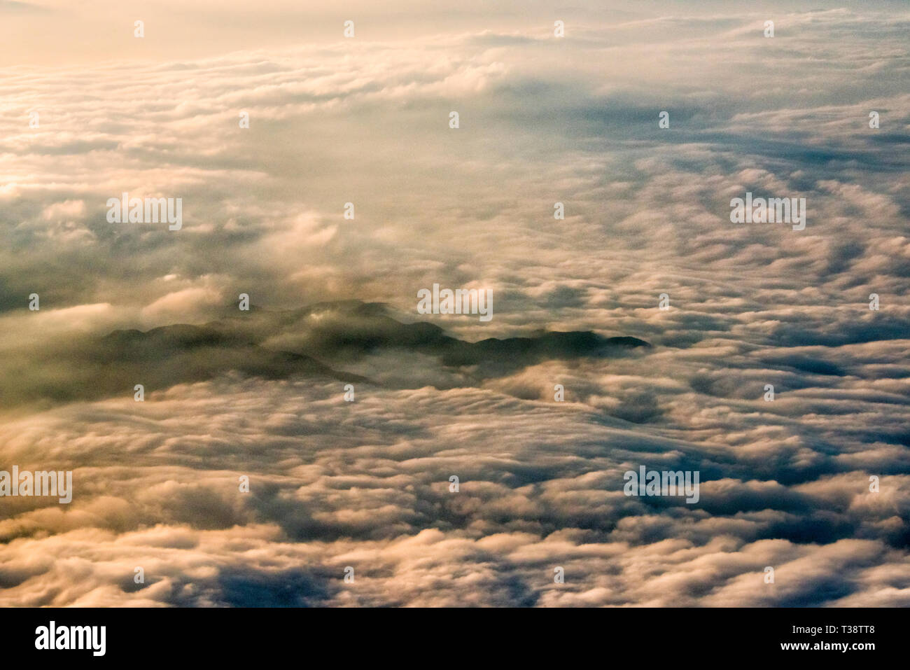 Aerial view of mountain shrouded in clouds, China Stock Photo - Alamy