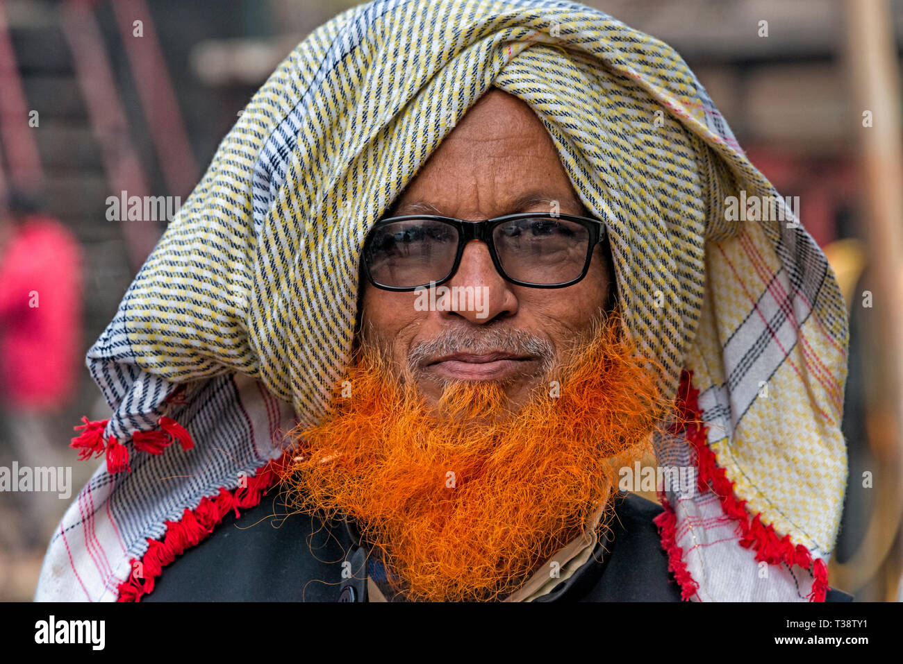 Man with beard dyed orange, Dhaka, Bangladesh Stock Photo