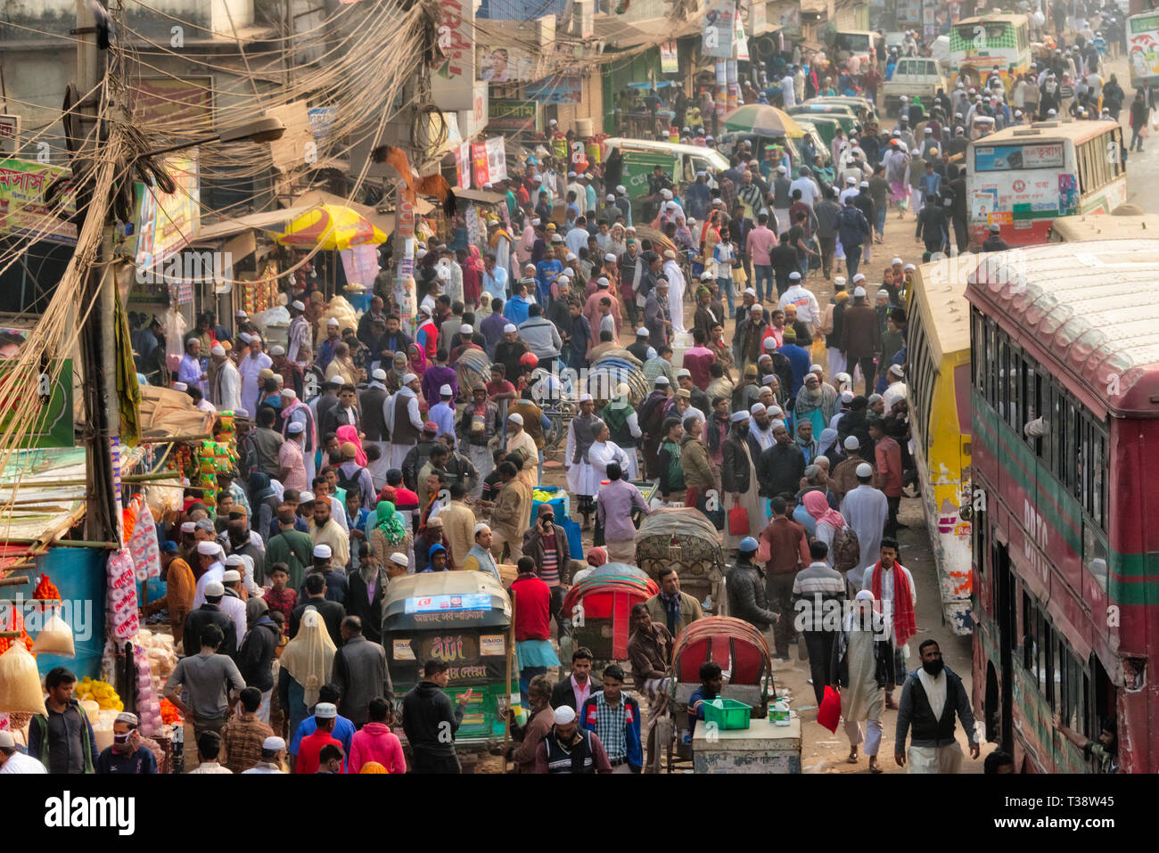 Busy street with crowds of people and buses, Dhaka, Bangladesh Stock Photo