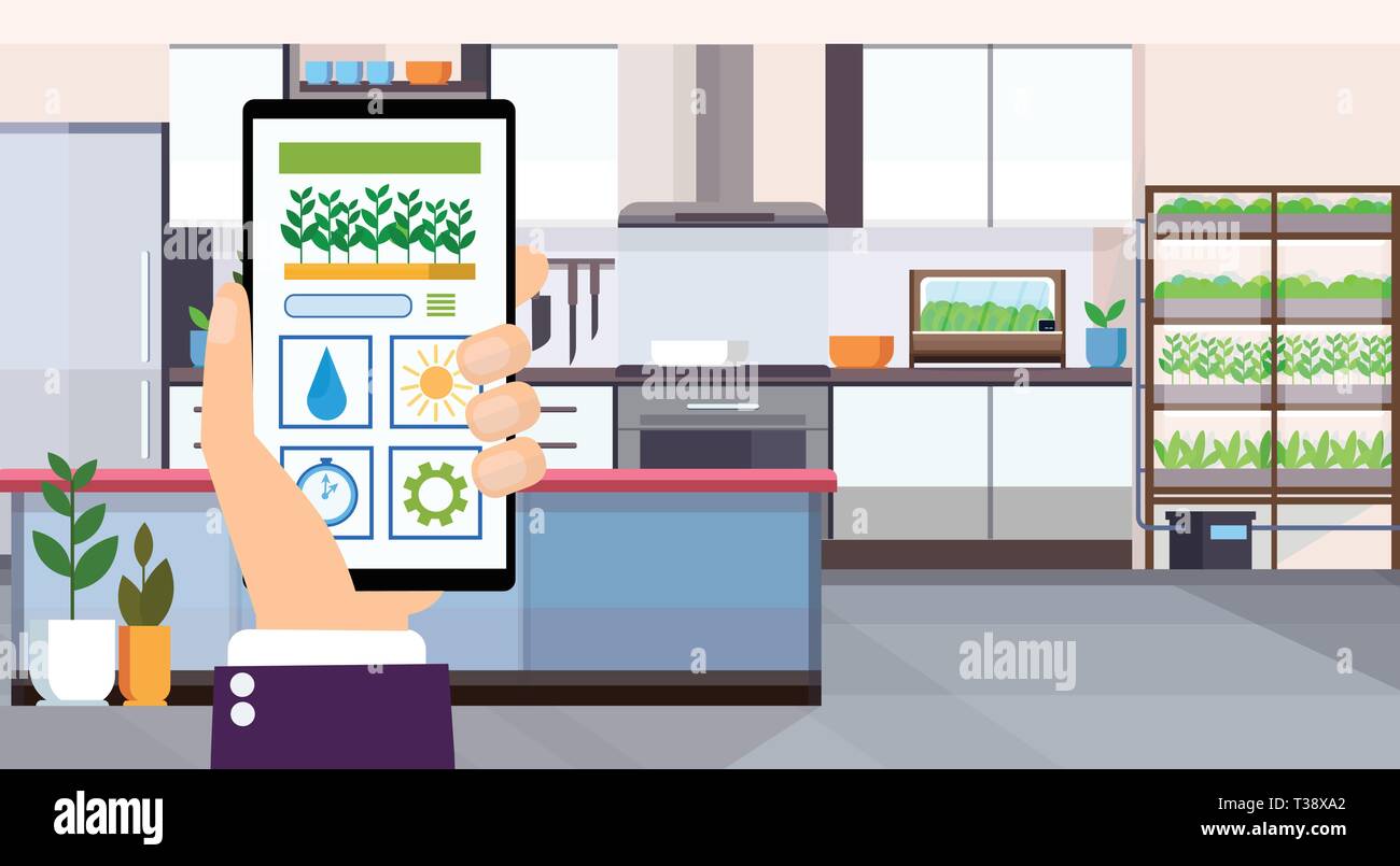 human hand using mobile app smart control plants growing system concept