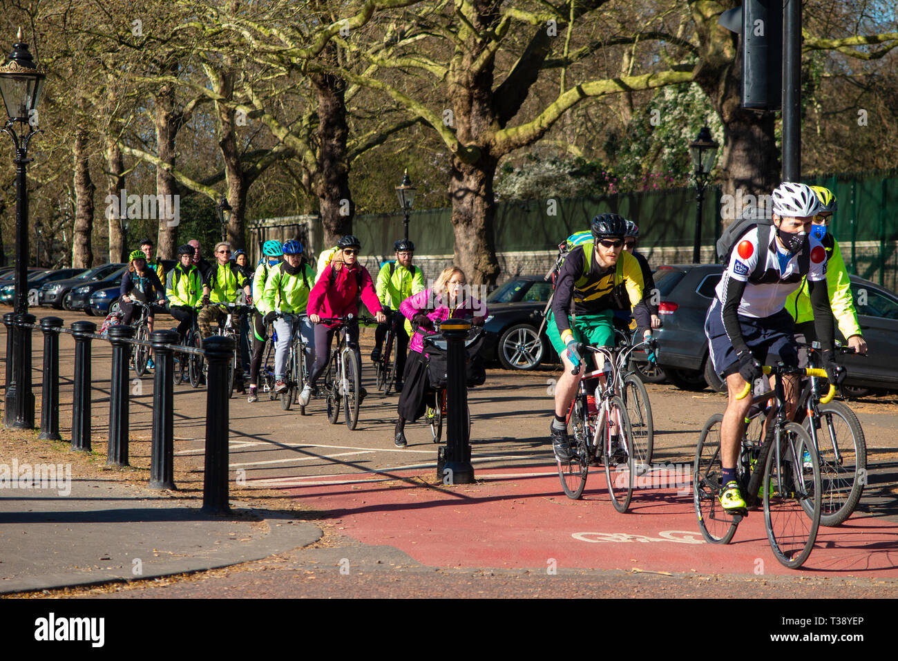A queue of cyclists riding to work on the Mall in central London Stock Photo