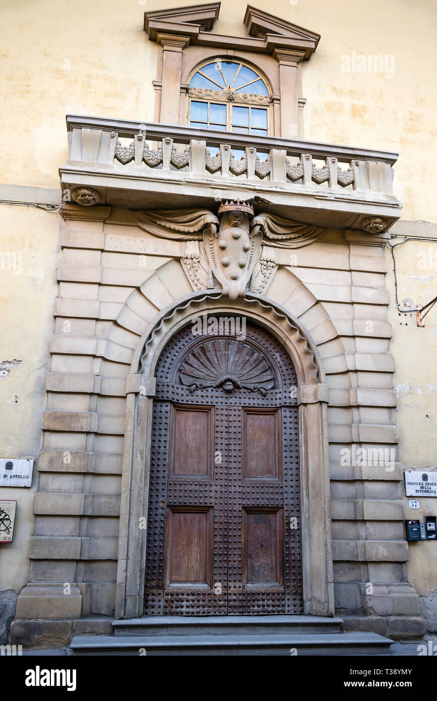 Florentine Renaissance arched doorway and broken pediment arched window
