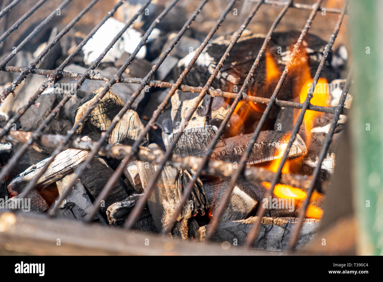 Grill charcoal burning with an open flame isolated Stock Photo Alamy