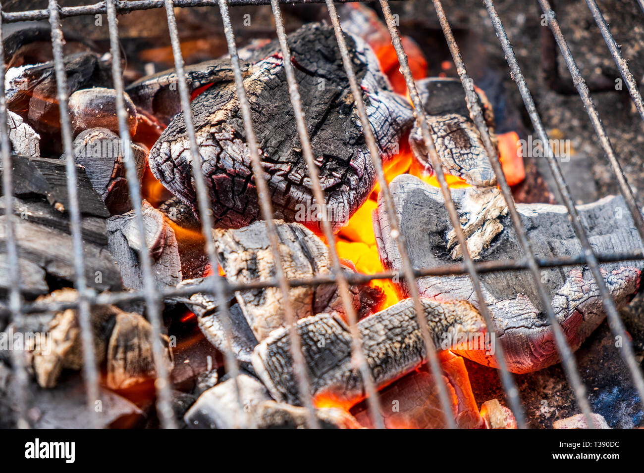 Grill charcoal burning with an open flame isolated Stock Photo Alamy
