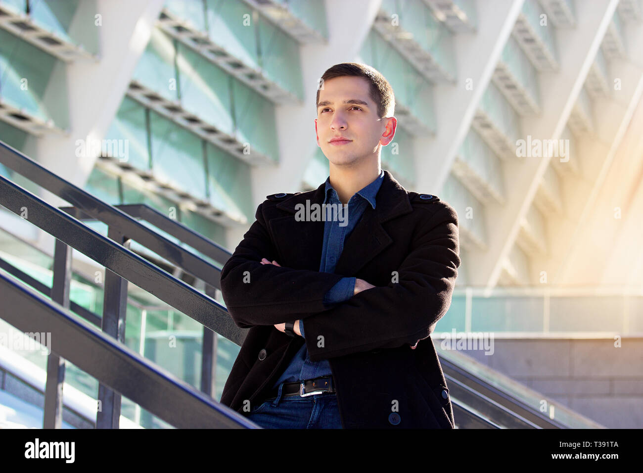 Successful young businessman working outdoors. Business concept. Stock Photo