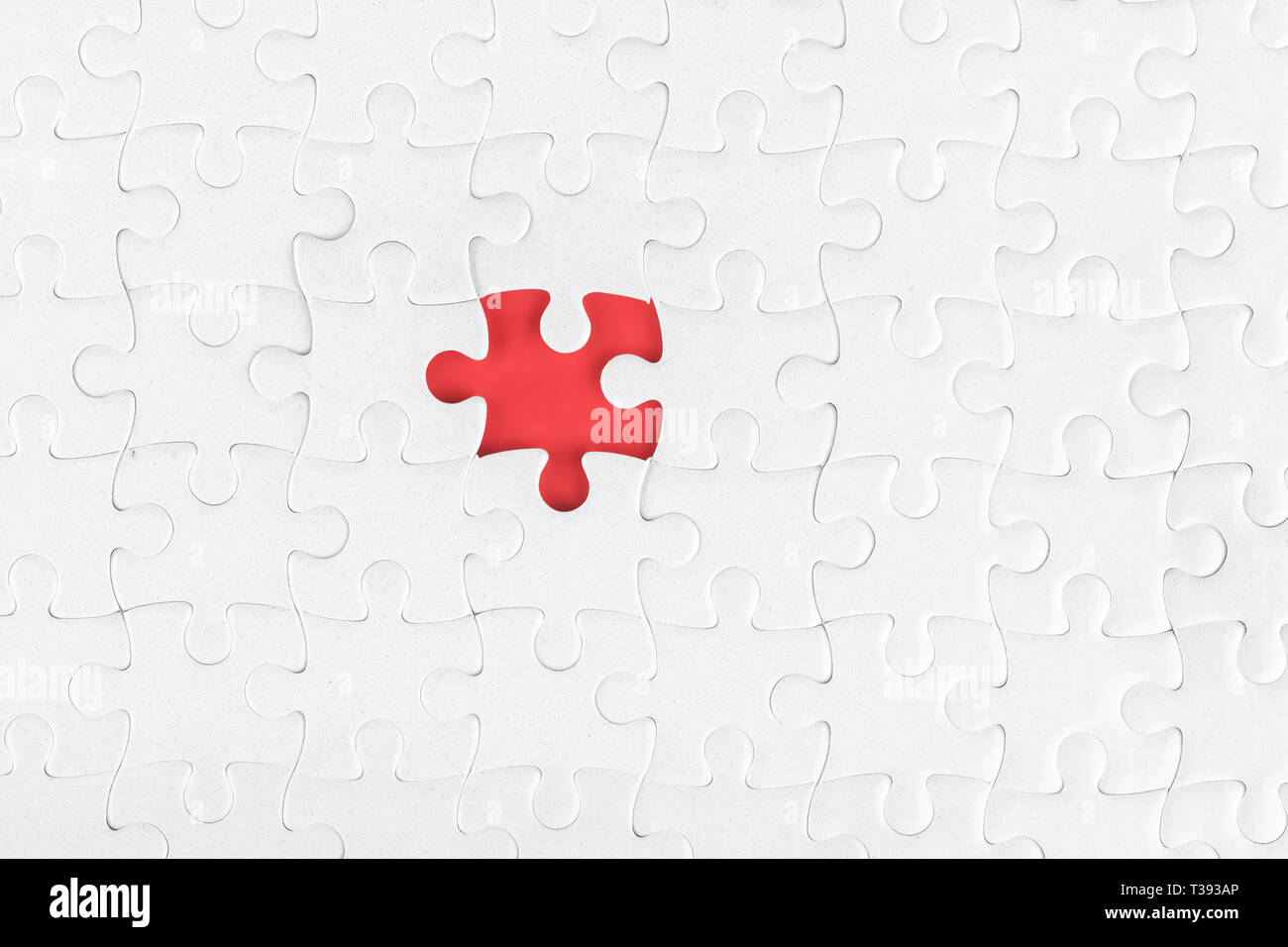 White blank jigsaw puzzle without one piece. Missing part and incompleteness theme Stock Photo