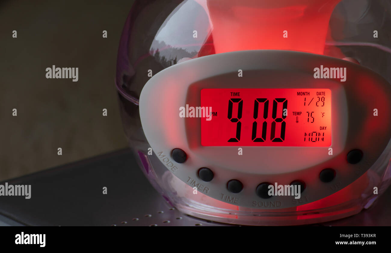 Digital electronic alarm clock that changes colors, closeup Stock Photo Alamy