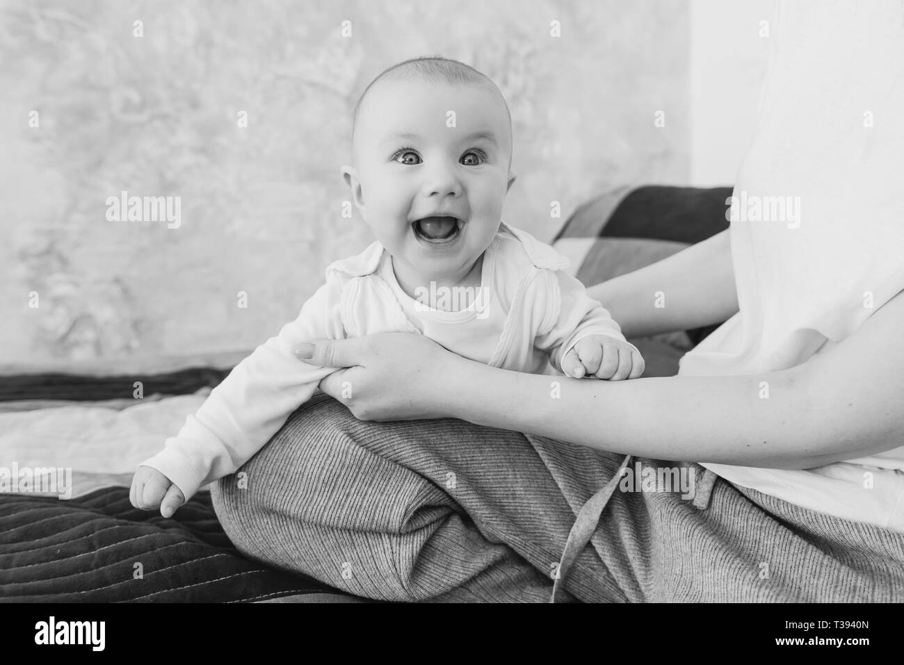 Portrait of smiling cute baby girl indoors Stock Photo