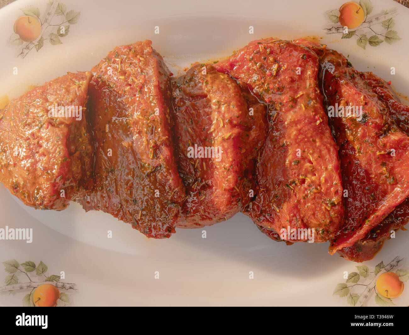 Raw marinated beef steak slices Stock Photo