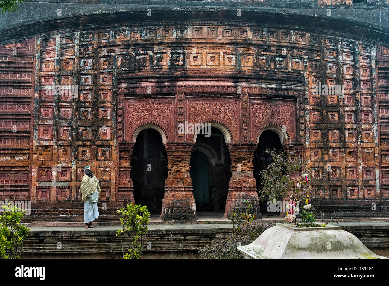 Man at the Pancharatna Gobinda Temple, part of Puthia Temple Complex, Rajshahi Division, Bangladesh Stock Photo