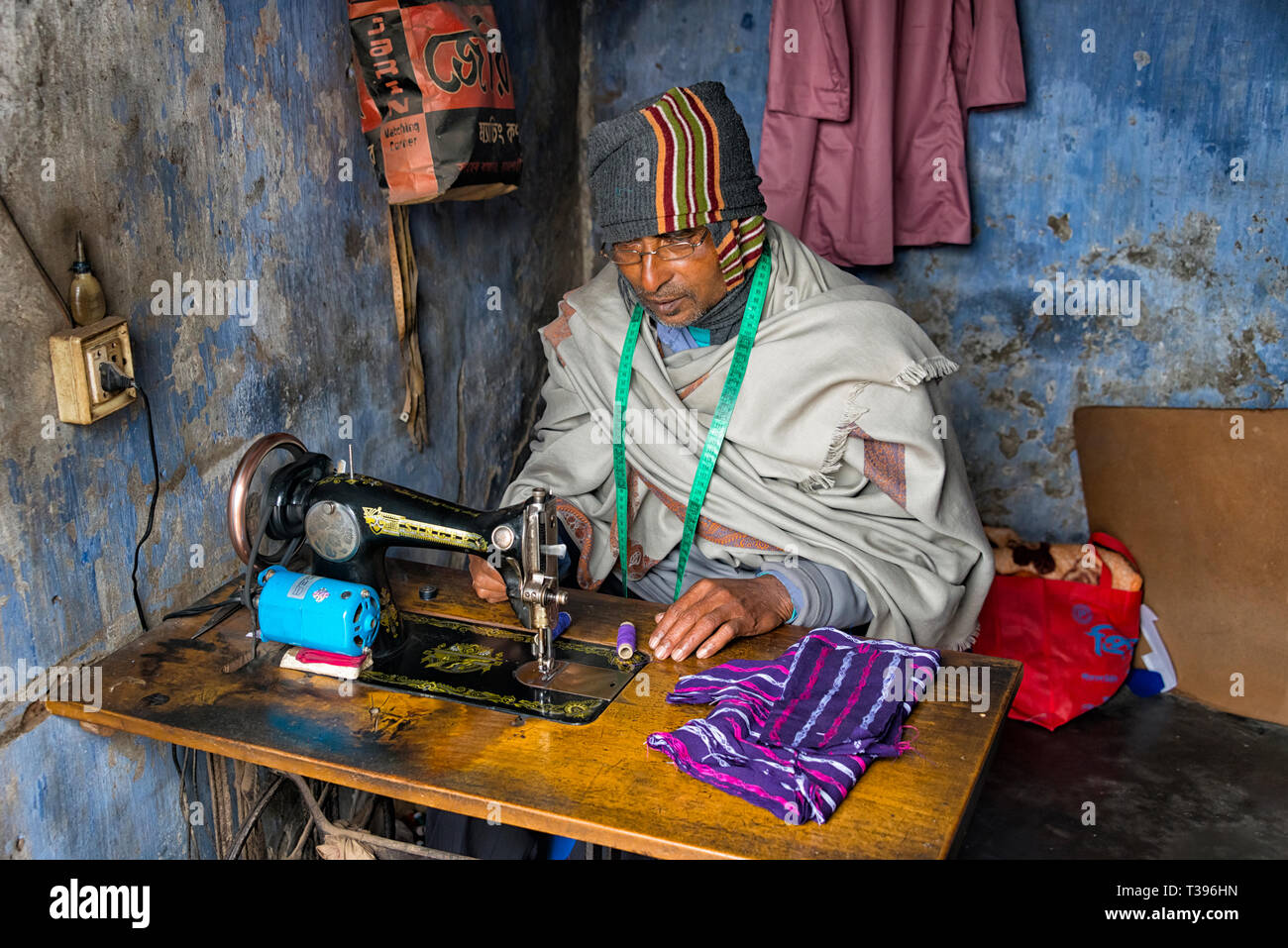 Tailor at the sewing machine, Puthia, Rajshahi Division, Bangladesh Stock Photo