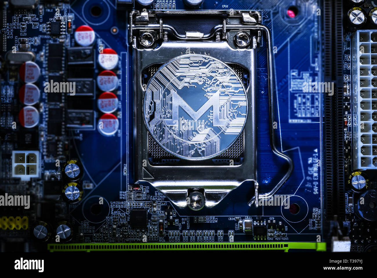 Top view of Monero cryptocurrency physical coin on computer mother board  processor.Bitcoin mining farm, working computer equipment concept Stock  Photo - Alamy