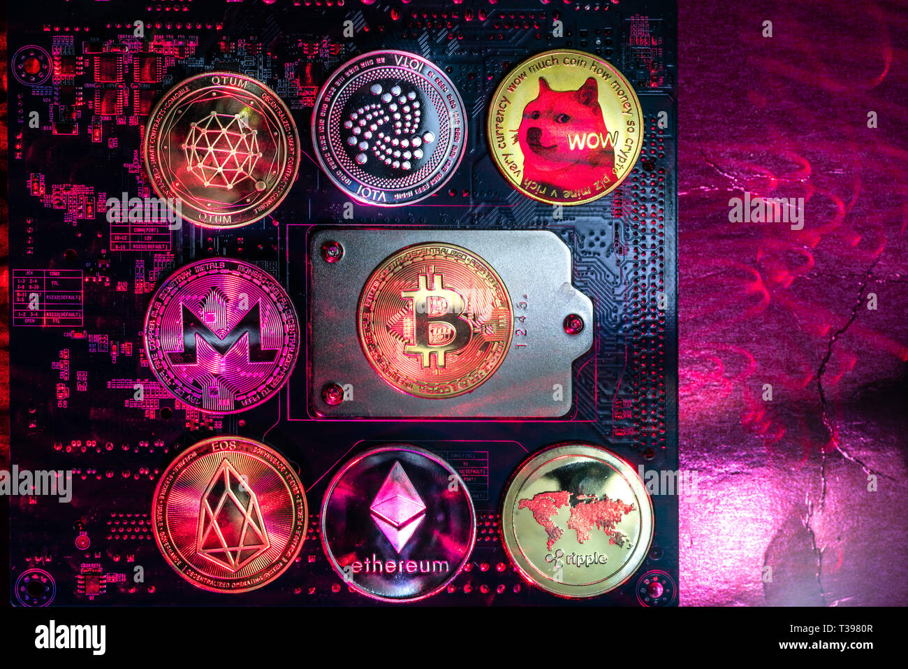 Top view of Bitcoin,Ripple,Ethereum,Eos,Monero,Iota,Dogecoin cryptocurrency  physical coins on computer mother board processor.Bitcoin mining farm, wor  Stock Photo - Alamy
