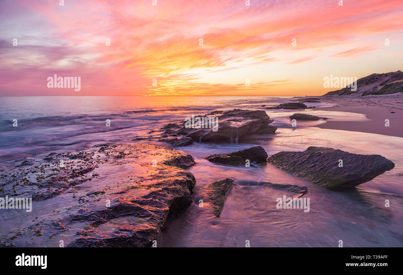 Limestone coastline and rock pools at Burns Beach at sunset. Perth, WA Stock Photo