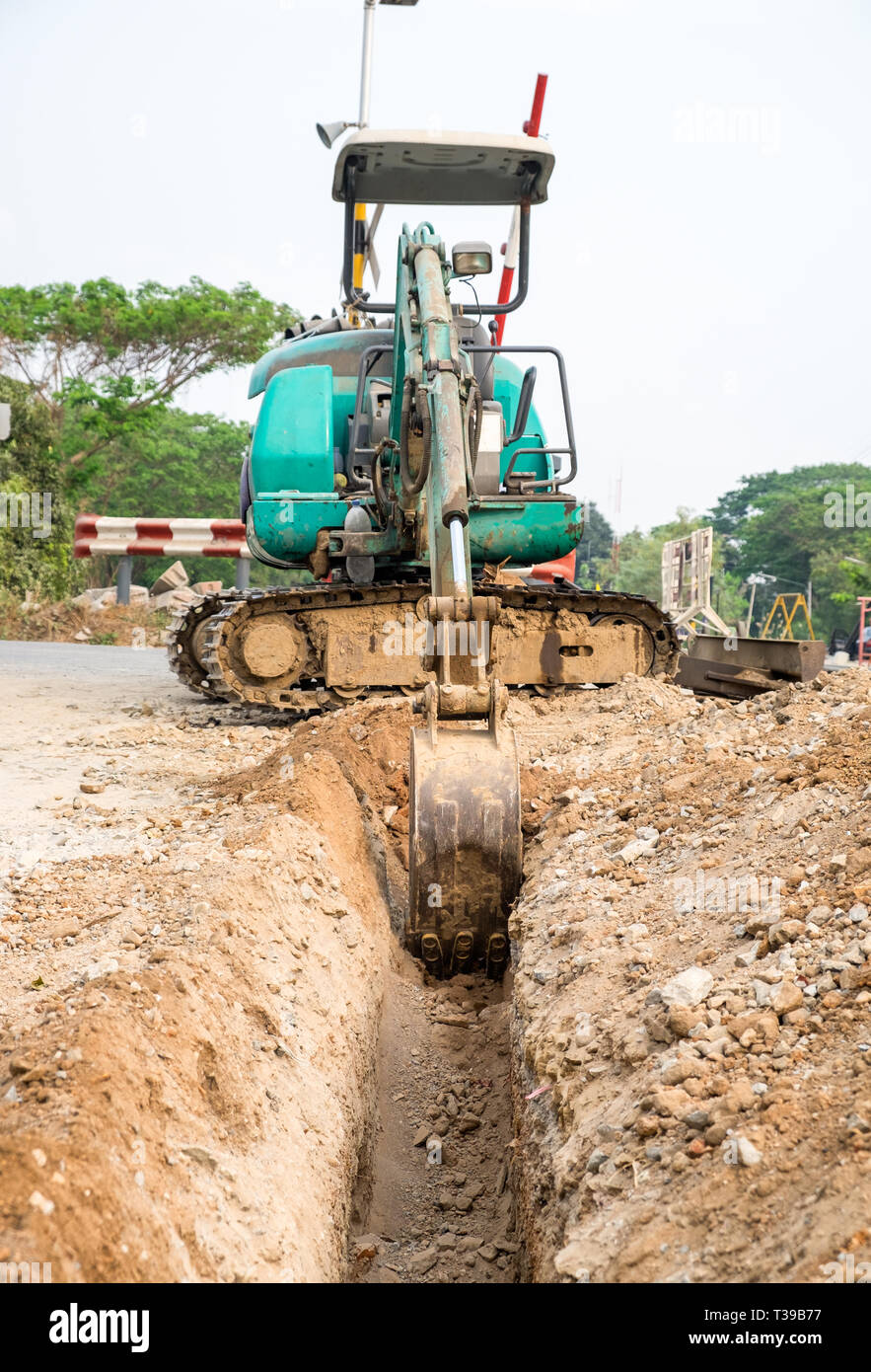 Green backhoe dredging soil earth Stock Photo Alamy