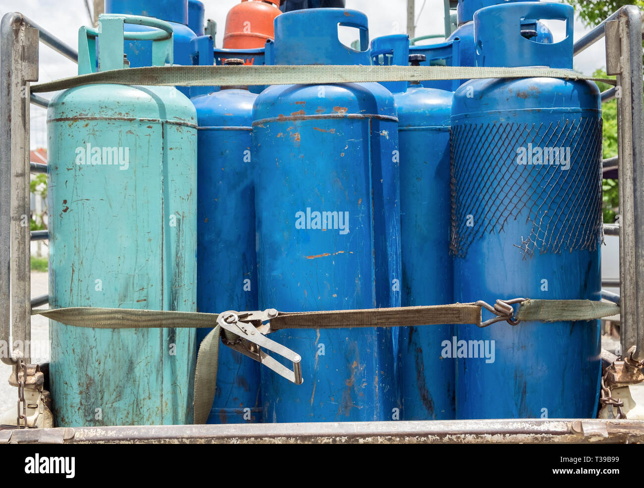 Liquid gas blue green old tanks carry on rear pickup Stock Photo Alamy