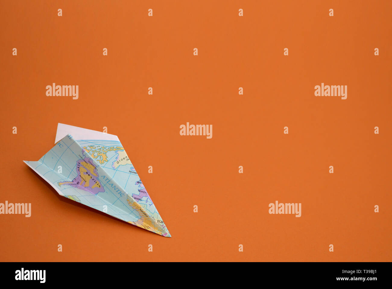 Paper planes from world map on paper background Stock Photo