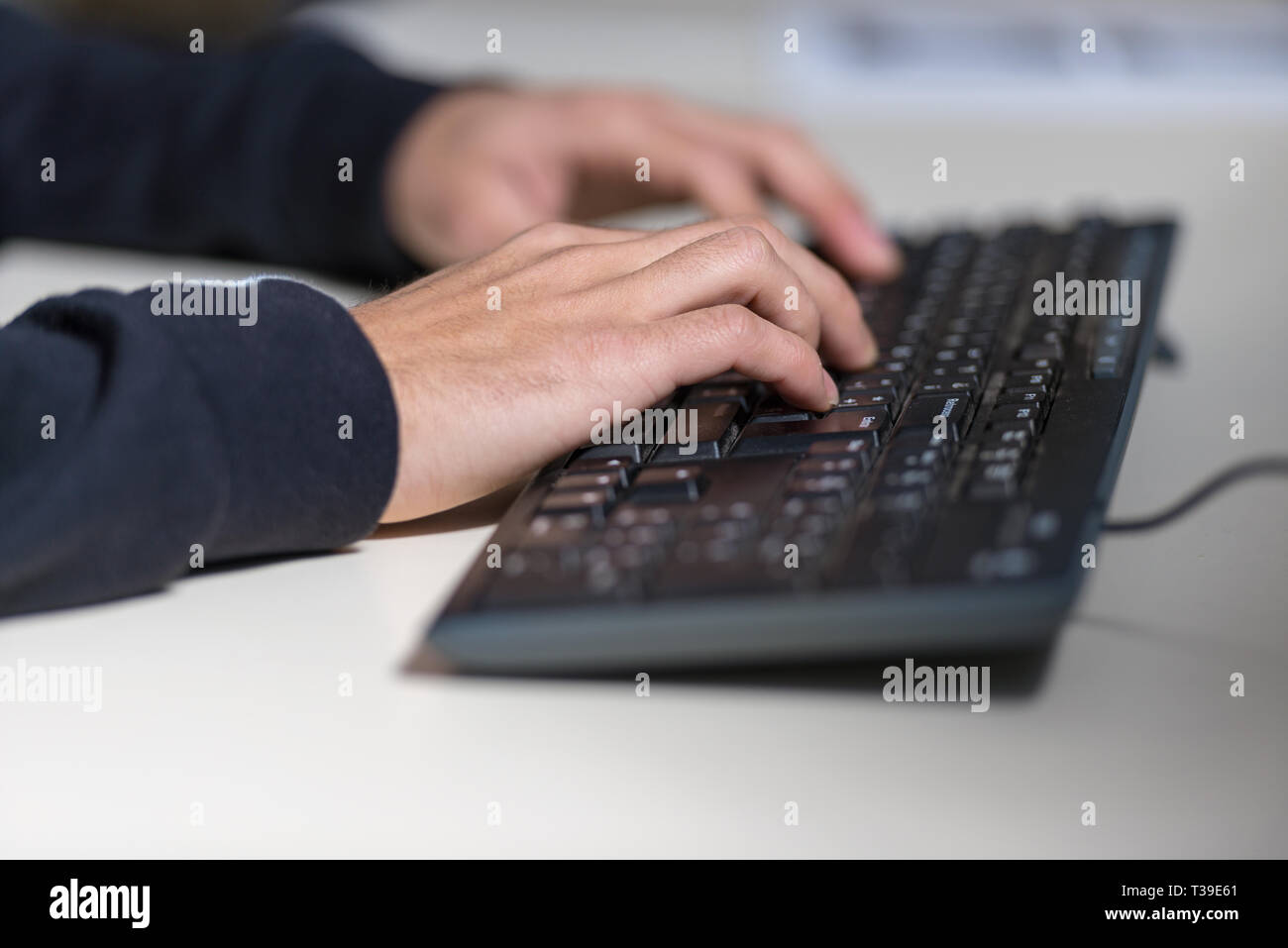 Hands of a young computer sicience student on a computer keyboard Stock ...