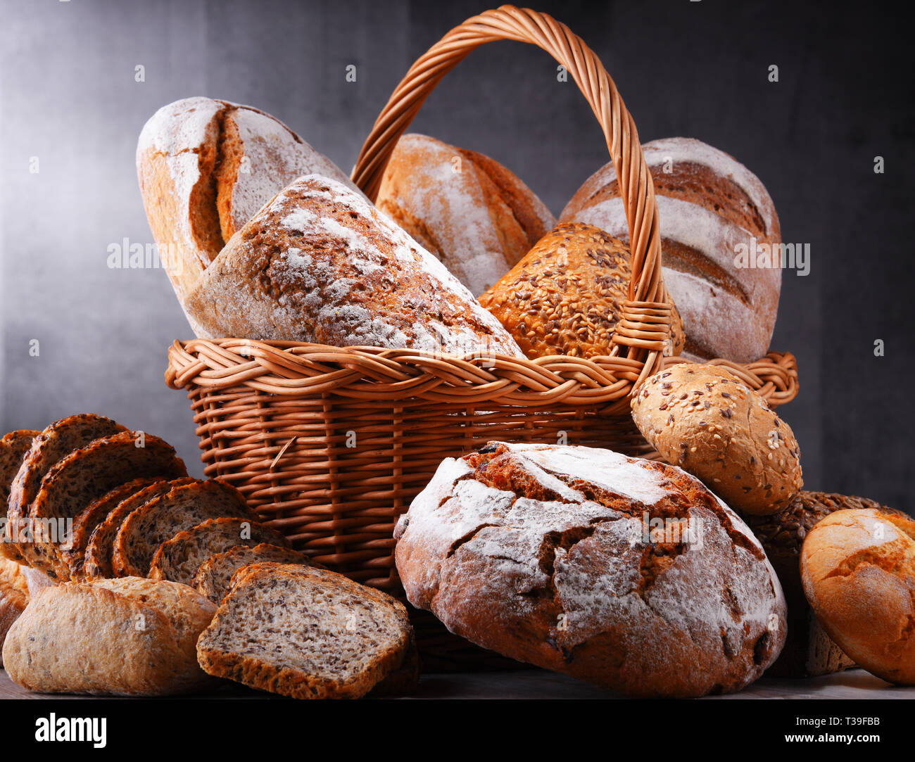 Composition with assorted bakery products in wicker basket Stock Photo