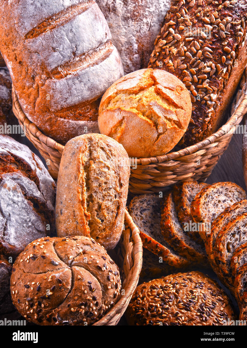 Composition with assorted bakery products in wicker basket Stock Photo