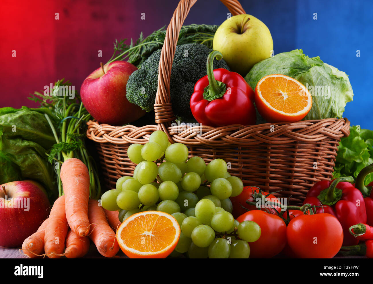 Fresh organic fruits and vegetables in wicker basket Stock Photo - Alamy