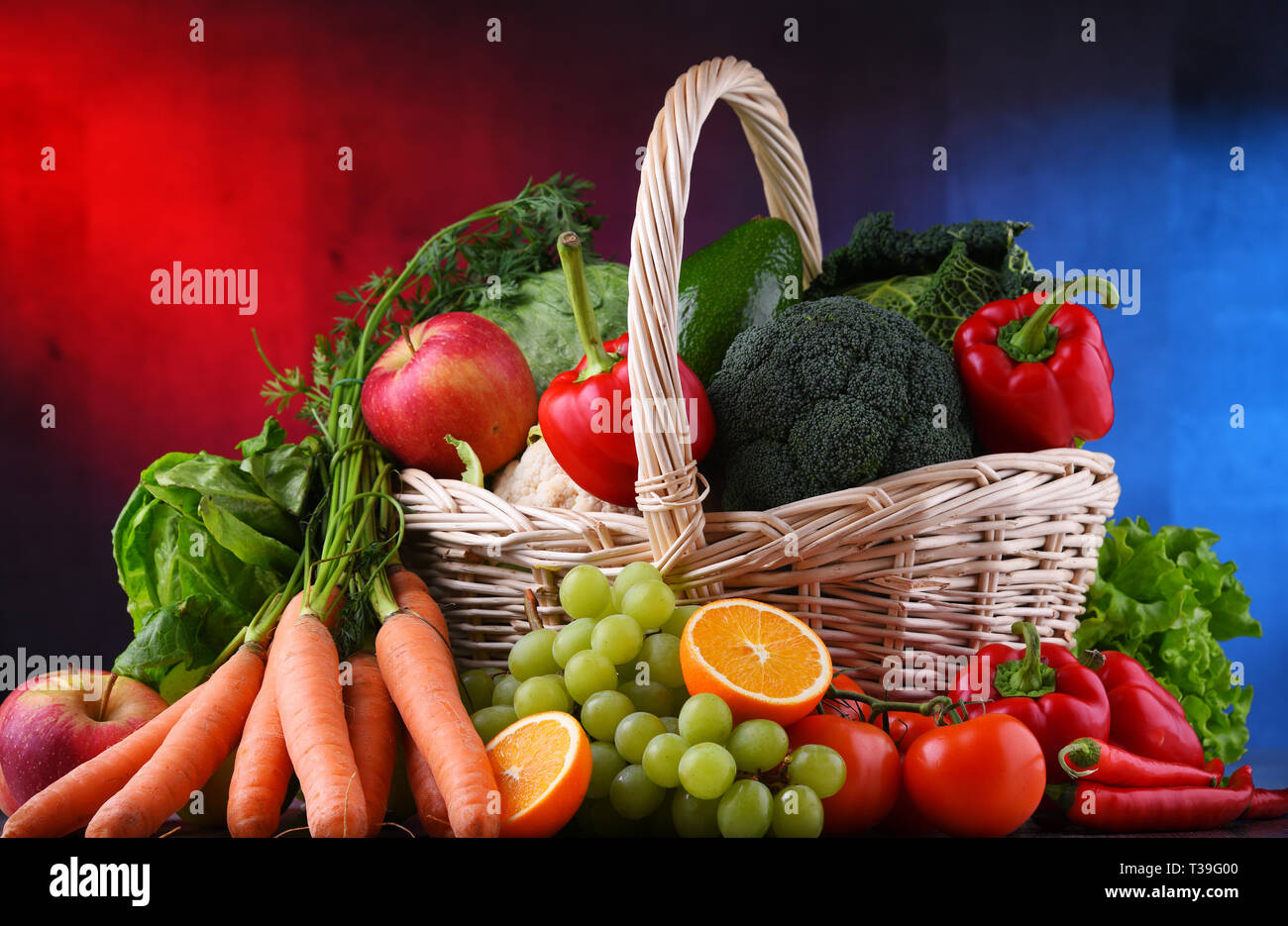 Fresh organic fruits and vegetables in wicker basket Stock Photo - Alamy