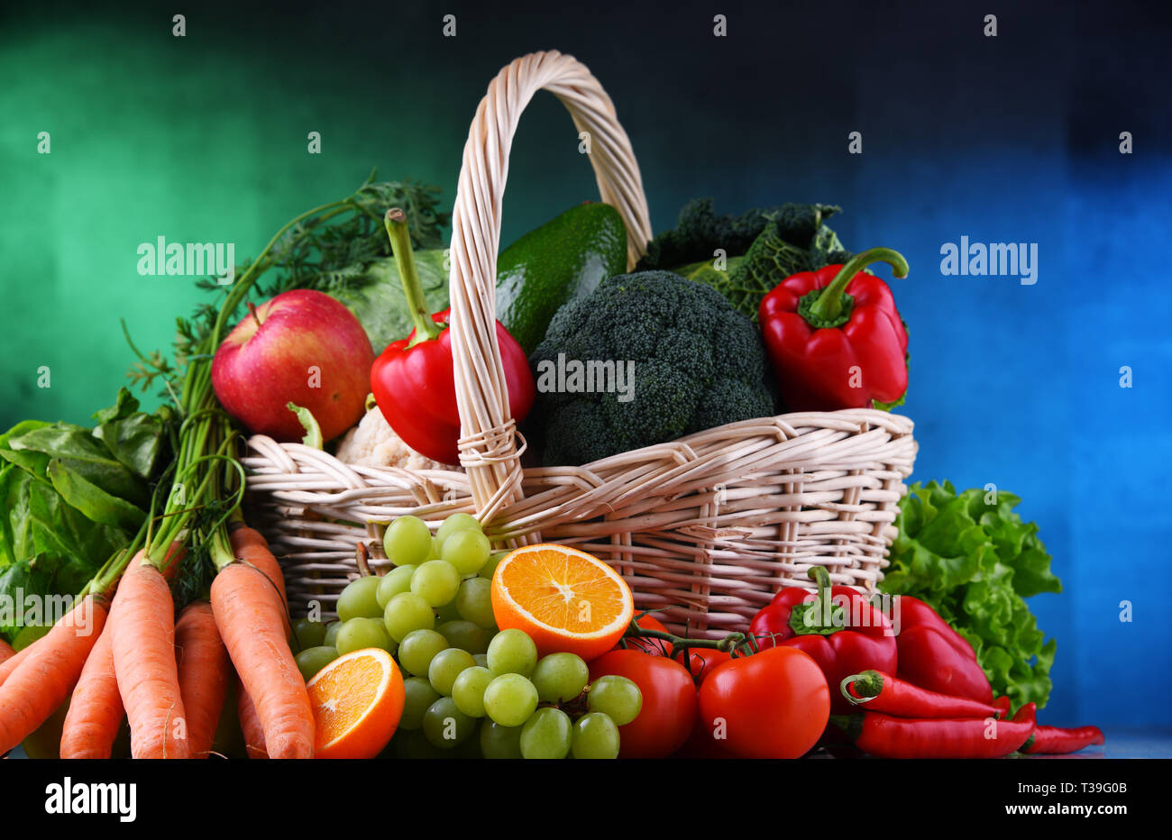 Fresh organic fruits and vegetables in wicker basket Stock Photo - Alamy