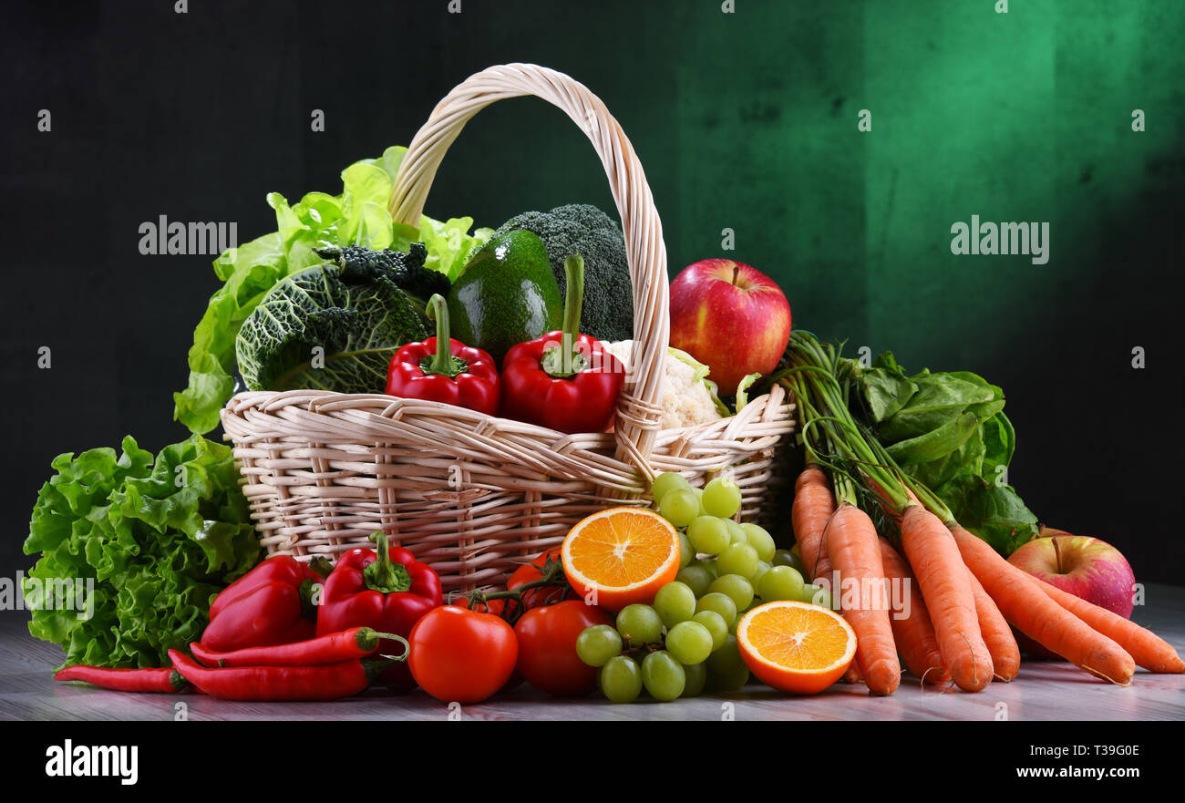 Fresh organic fruits and vegetables in wicker basket Stock Photo - Alamy