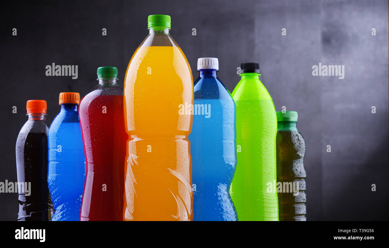 Plastic Bottles Of Assorted Carbonated Soft Drinks In Variety Of Colors 