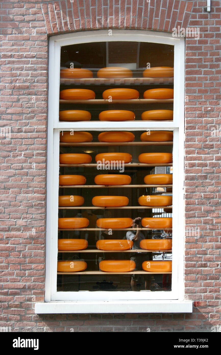 A window with cheeses for sale Stock Photo