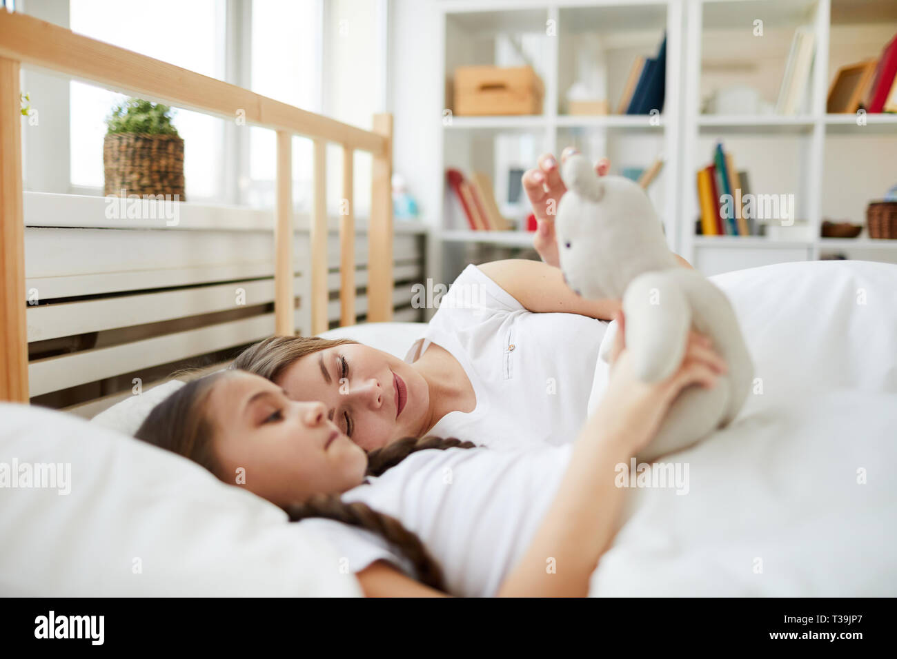 Mother and Daughter in Bed Stock Photo