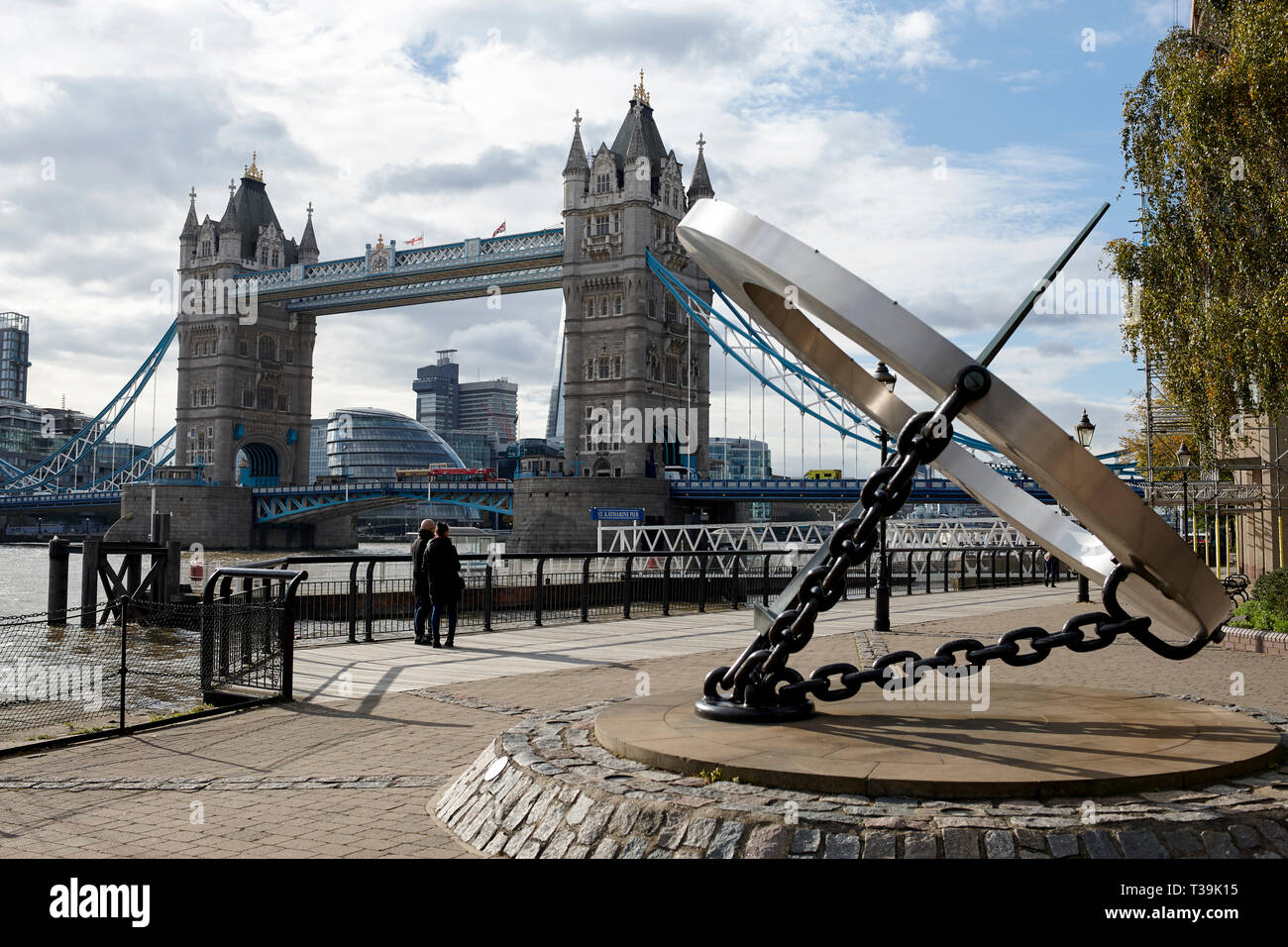London's Tower Bridge with the Timepiece Sundial in the foreground on the north bank of the River Thames, England, UK. Stock Photo