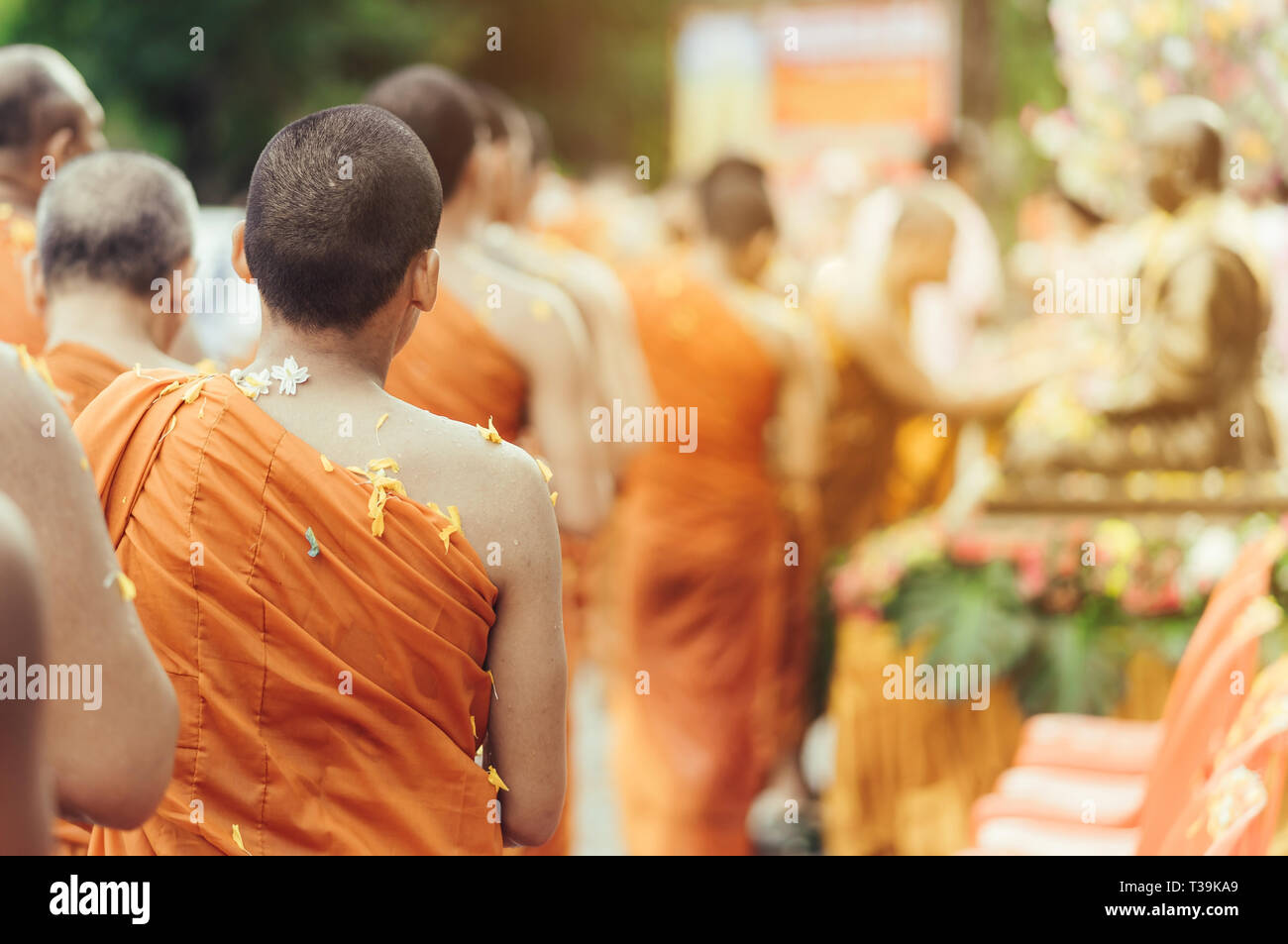 Group of Monks bath Buddha sculputer purify body and spirit in Songkran