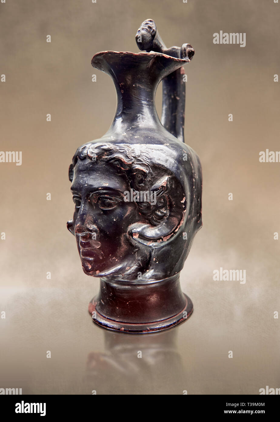 Etruscan bucchero jug with a face,  National Archaeological Museum Florence, Italy Stock Photo