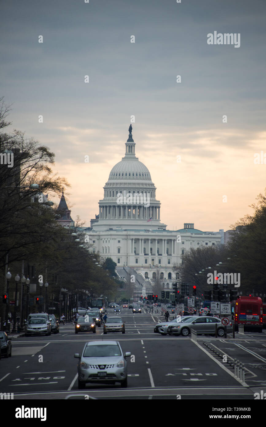 US Capitol emerges from a cloudy Sunrise Stock Photo - Alamy
